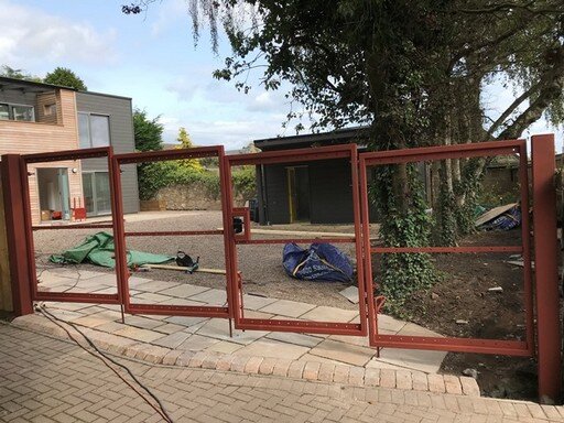 Bifold gates for house in Strathkinnes ready to be clad.JPG